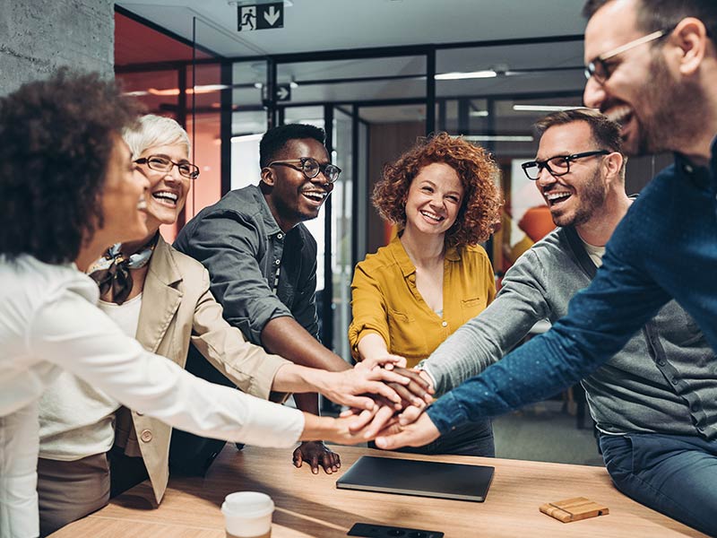 employees keeping their hand on others hand alternatively