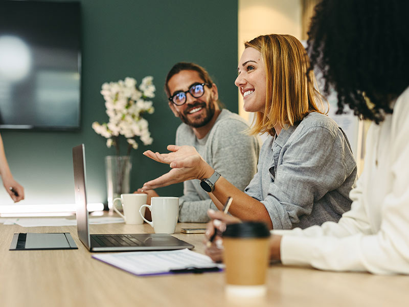 Business woman talking to her colleagues during a meeting